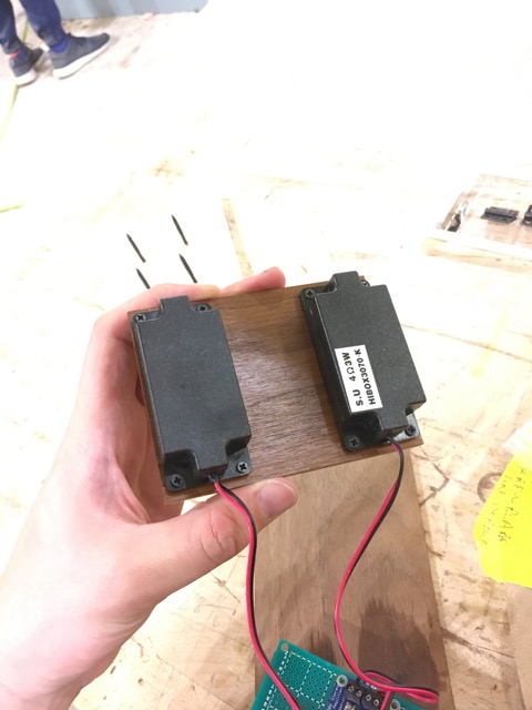 Speakers screwed into the back of the false bottom